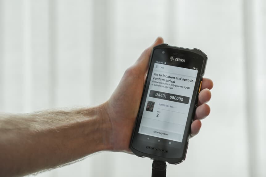 Handheld mobile device displaying Mobile Fulfillment app