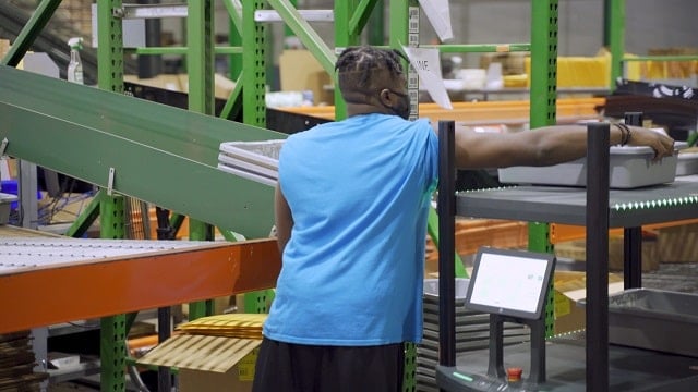 Warehouse associate conducting e-commerce fulfillment activities